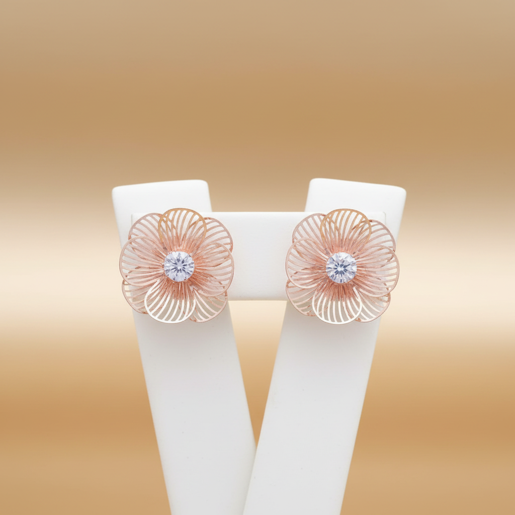 Rose Gold Flower Stud Earrings on ceramic stand champagne gold background