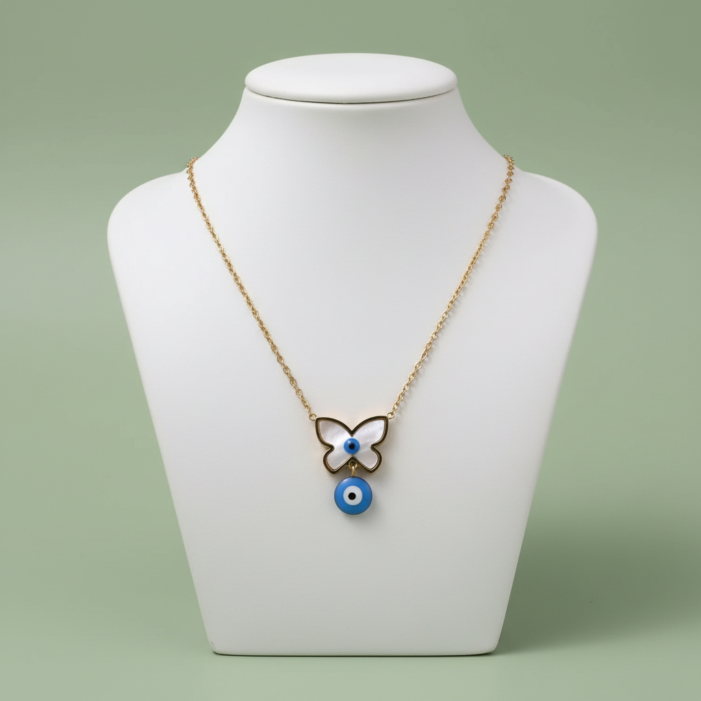 Butterfly Evil Eye Necklace on ceramic bust sage green background