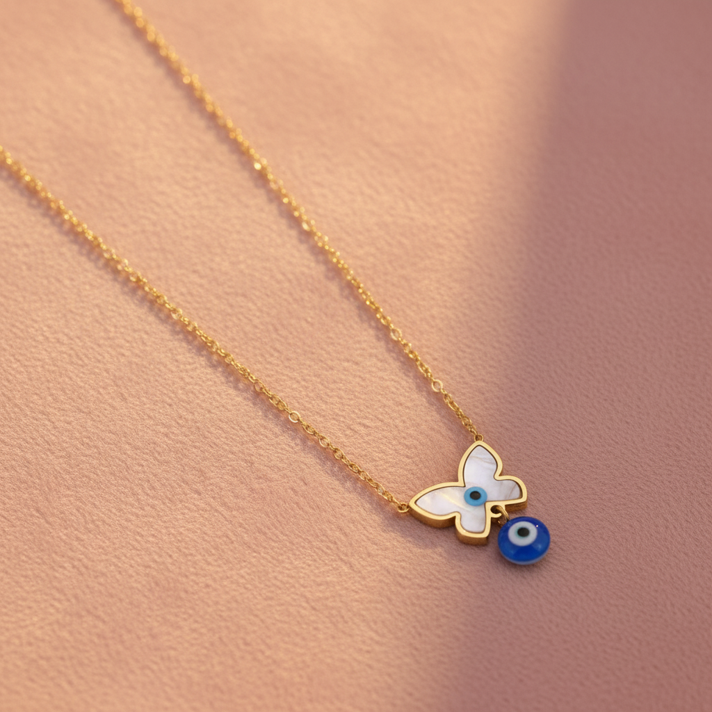 Butterfly Evil Eye Necklace on blush pink velvet
