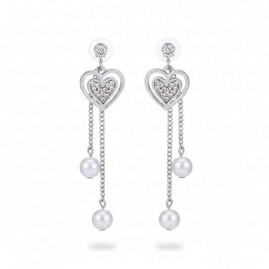 Silver heart drop earrings front view on white background
